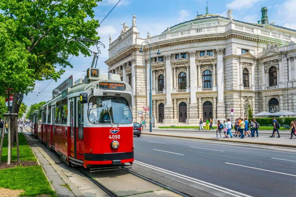 Historic red tram in front of the Hofburg in Vienna