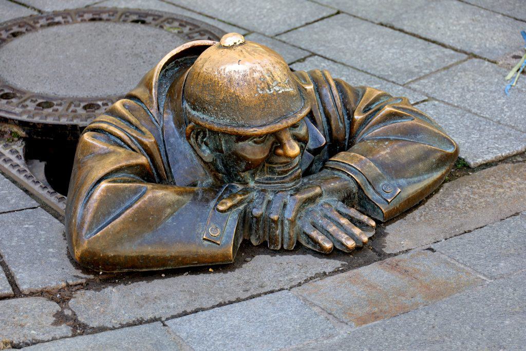 Čumil, the bronze sewer-worker statue in Bratislava Old Town