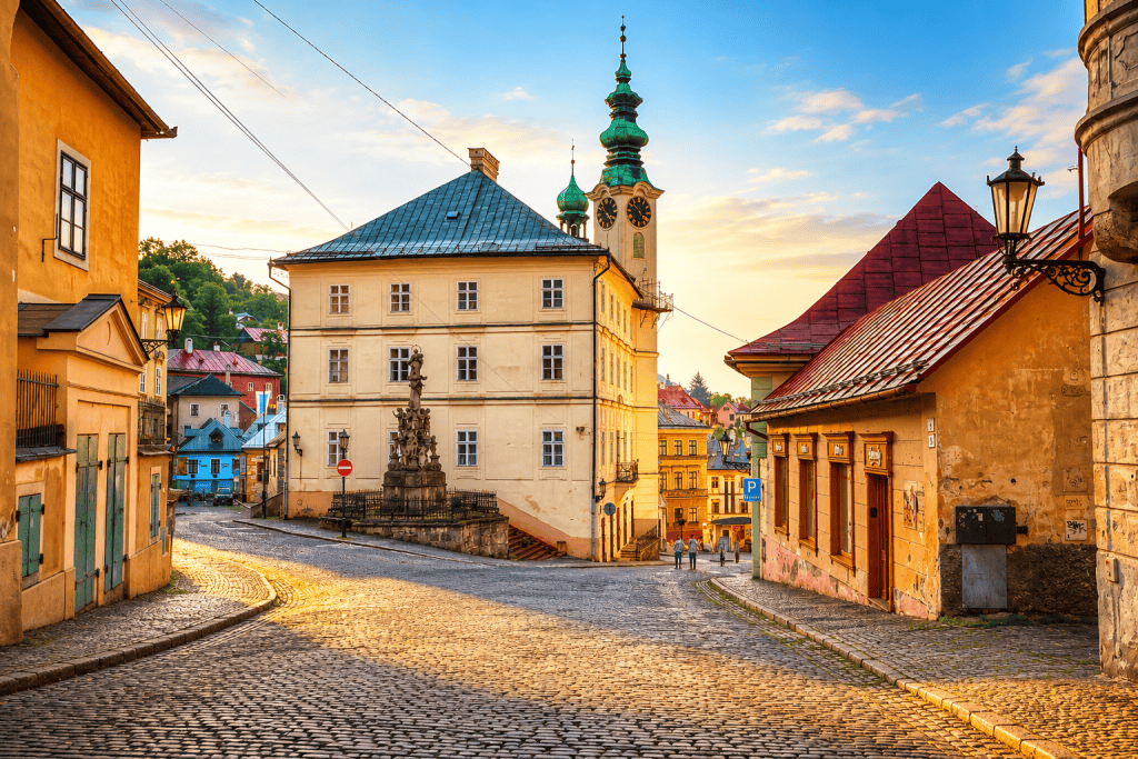Cobbled old town street of Banska Stiavnica at sunset