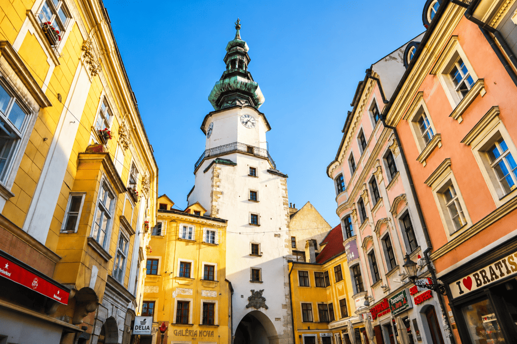 Michael's Gate tower rising over Bratislava Old Town street