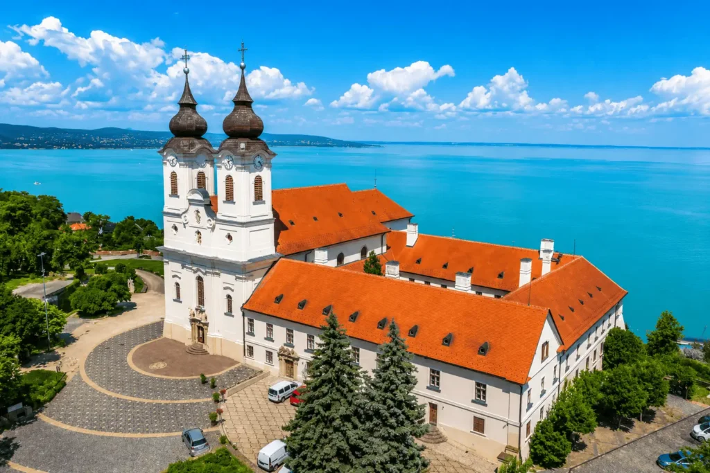 Tihany Abbey twin towers overlooking turquoise Lake Balaton